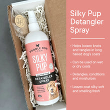 Load image into Gallery viewer, Silky Pup bottle inside gift box with crinkle paper. Right side has pink bar with bullets points about product.