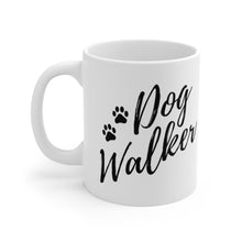 Load image into Gallery viewer, dog walker scrip font with two paws in black on white ceramic mug, handle on left side