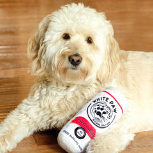 Load image into Gallery viewer, beautiful mini goldendoodle holding white paw hound seltzer dog toy
