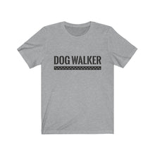 Load image into Gallery viewer, black text that reads "dog walker" in a cool Army-like font with A trail of paw prints inside a rectangle underneath the text on gray T-shirt