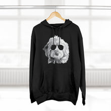 Load image into Gallery viewer, black hoodie sweatshirt with black and white illustration of goldendoodle dog with black sunglasses on front hanging from wood hanger