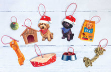 Load image into Gallery viewer, 9 DIY ornaments. A bone, a green ball, a red goldendoodle wearing a santa hat, a black doodle wearing a santa hat, a bag of dog food, a rope toy, a bowl of food and a bed ornament. All have red loop tags to hang. All lying flat on white shiplap background
