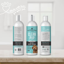 Load image into Gallery viewer, Made with love for your pet written in script by a heart paw graphic in top left. Clean Pup 5-in-1 Dog Wash bottle shown three times, so all sides of label are shown. The bottles are sitting on bathroom counter with white blurred window in background
