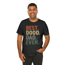 Load image into Gallery viewer, dark skinned man wearing black t-shirt that reads BEST.DOOD.DAD.EVER. in red yellow gray and green colors
