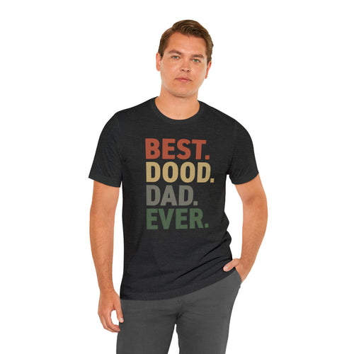 white guy wearing black t-shirt that reads BEST.DOOD.DAD.EVER. in red yellow gray and green colors