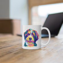 Load image into Gallery viewer, colorful Bernedoodle or Goldendoodle dog pop art illustration on white ceramic mug sitting on wooden desk with blurred out laptop behind it
