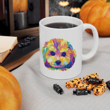 Load image into Gallery viewer, colorful Cavapoo dog pop art illustration on ceramic mug with steaming coffee and Halloween candy in front with pumpkins and black candles behind.
