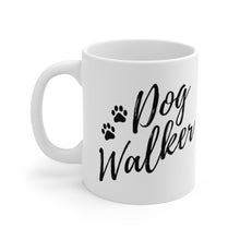 Load image into Gallery viewer, dog walker scrip font with two paws in black on white ceramic mug, handle on left side
