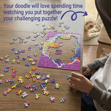 Load image into Gallery viewer, boys hands putting together bright colorful goldendoodle puzzle on ktichen table with dog watching in the background. Words on photo read: Your doodle will love spending time watching you put together your challenging puzzle!
