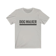 Load image into Gallery viewer, black text that reads &quot;dog walker&quot; in a cool Army-like font with A trail of paw prints inside a rectangle underneath the text on silver T-shirt
