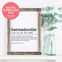 Load image into Gallery viewer, A Bernedoodle Dictionary Definition print inside a rustic farmhouse frame in front of a white shiplap wall with green vase and leaves next to it.
