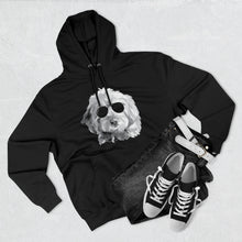 Load image into Gallery viewer, black hoodie sweatshirt lying flat with black and white illustration of goldendoodle dog with black sunglasses. a pair of black jeans and bland and white shoes are lying next to the sweatshirt
