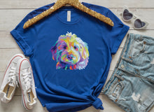 Load image into Gallery viewer, royal blue t-shirt tied in knot with colorful Goldendodle dog pop art graphic on front of t-shirt. gold sequence hanger, white conver shoes with red stripe, white heart sunglasses and jean shorts with holes surrounding the shirt
