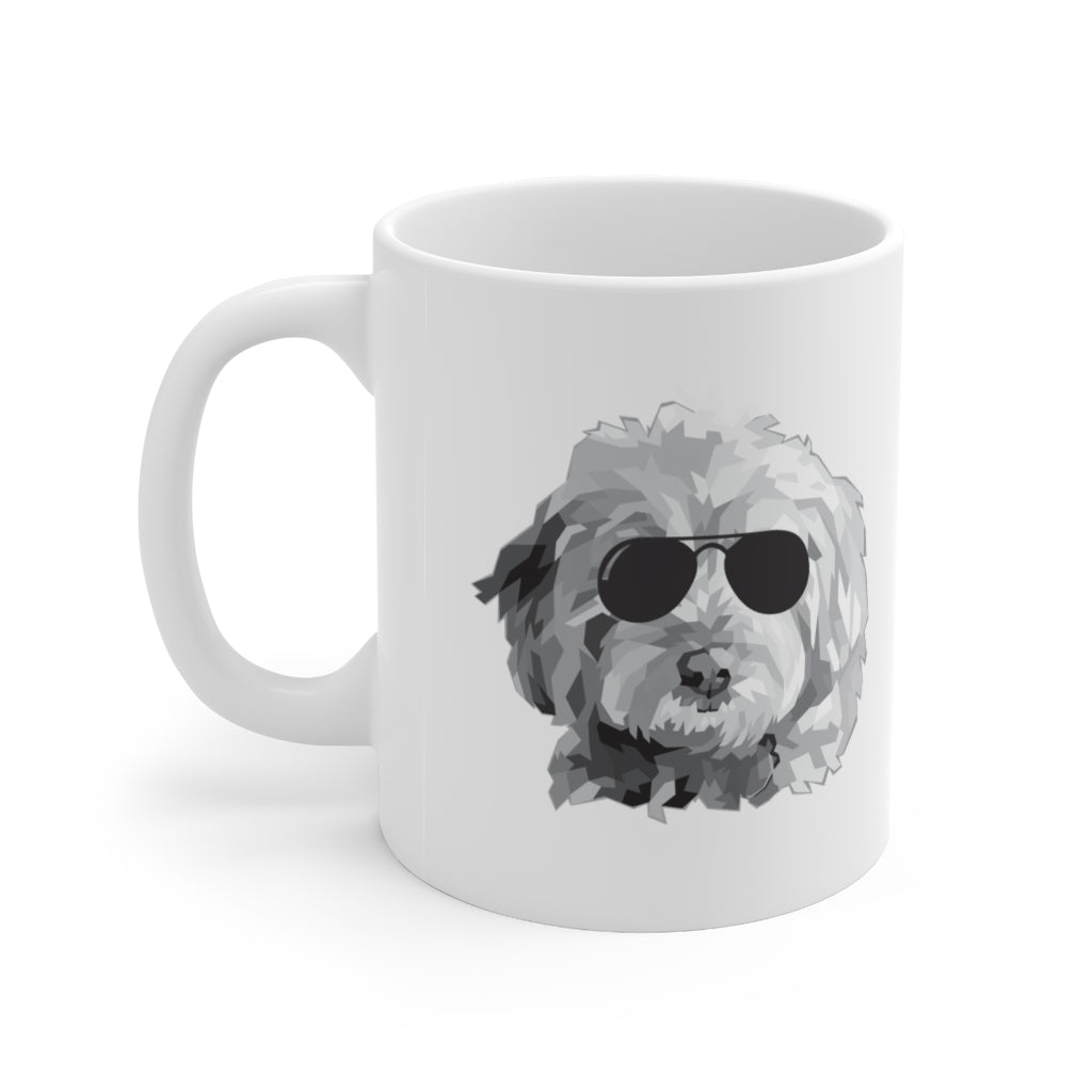black and white goldendoodle with black sunglasses graphic on white ceramic mug with handle on left side