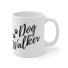 Load image into Gallery viewer, dog walker scrip font with two paws in black on white ceramic mug, handle on right side
