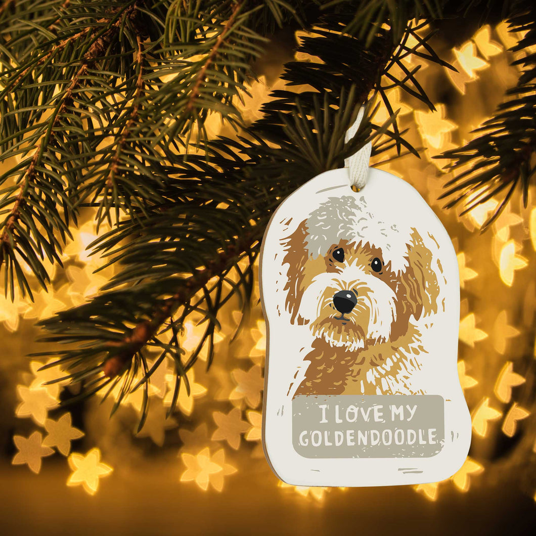 cute tan and white wooden ornament with goldendoodle and I Love My Goldendoodle saying hanging on Christmas tree with yellow lights